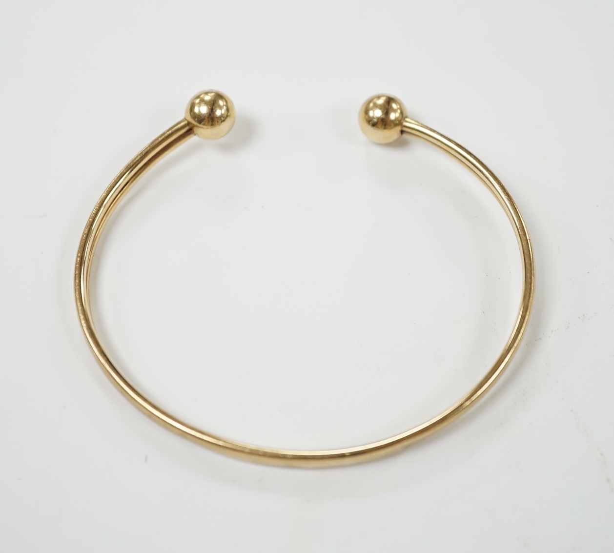 A 9ct gold torque bangle, 4.7 grams. Condition - fair to poor